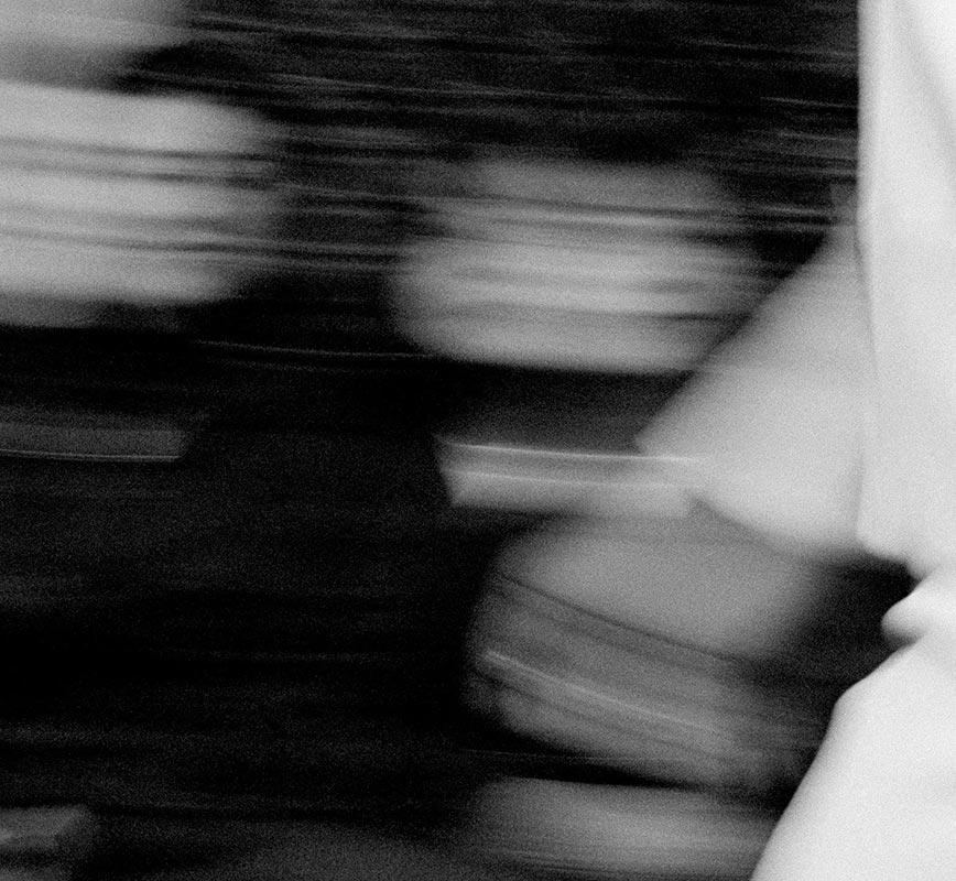 Detail of Black and white photograph of fashion show by French fashion designer Jerome L Huillier. Title: Jerome L Huillier - Blanc