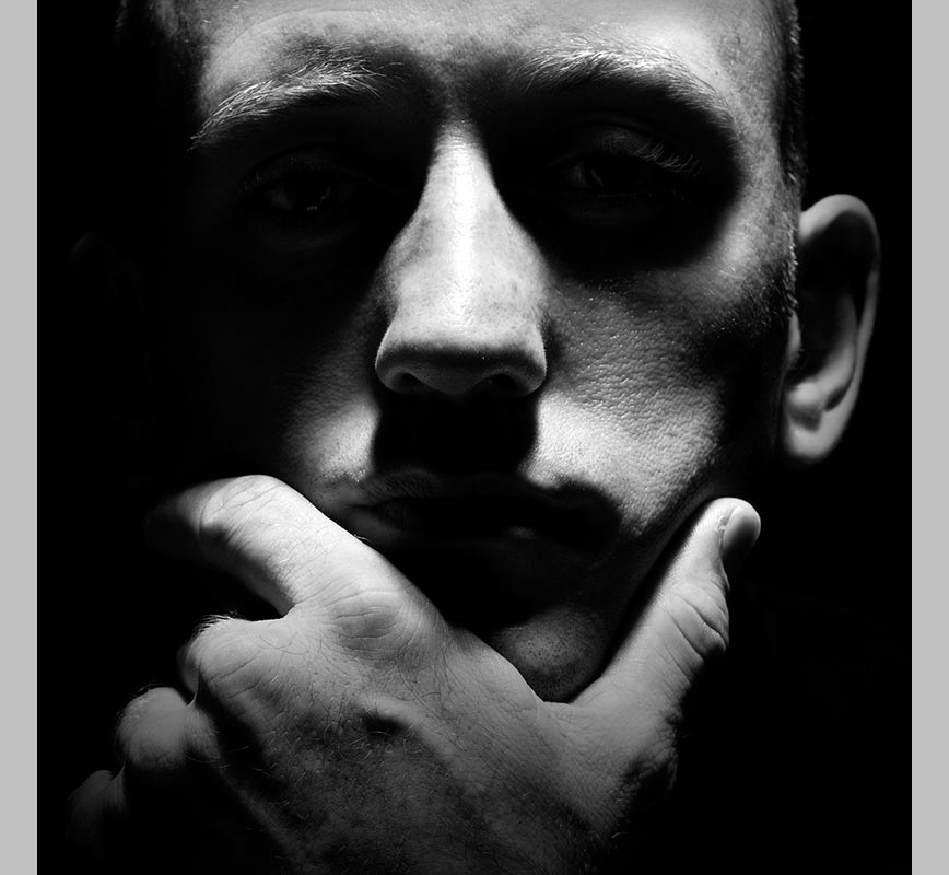 Black and white photographic portrait of pensive man. Title: Untitled #7