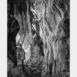 Black and white photograph of caves in the Greek island of Kithira inspired by the writings of the ancient Greek philosopher Heraclitus. Title: Homage to Heraclitus: Earth II