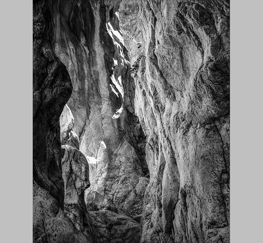 Black and white photograph of caves in the Greek island of Kithira inspired by the writings of the ancient Greek philosopher Heraclitus. Title: Homage to Heraclitus: Earth II