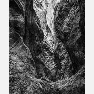 Black and white photograph of caves in the Greek island of Kithira inspired by the writings of the ancient Greek philosopher Heraclitus. Title: Homage to Heraclitus: Earth III