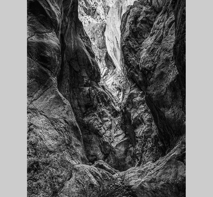 Black and white photograph of caves in the Greek island of Kithira inspired by the writings of the ancient Greek philosopher Heraclitus. Title: Homage to Heraclitus: Earth III