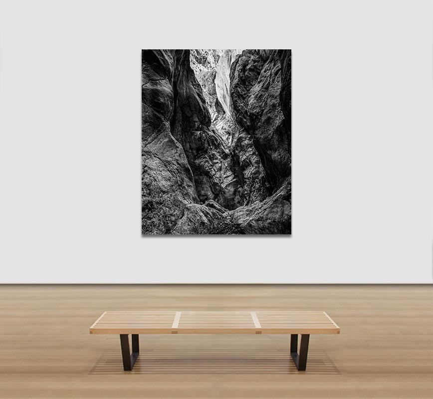 View in a Room of Black and white photograph of caves in the Greek island of Kithira inspired by the writings of the ancient Greek philosopher Heraclitus. Title: Homage to Heraclitus: Earth III