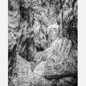 Black and white photograph of caves in the Greek island of Kithira inspired by the writings of the ancient Greek philosopher Heraclitus. Title: Homage to Heraclitus: Earth IV