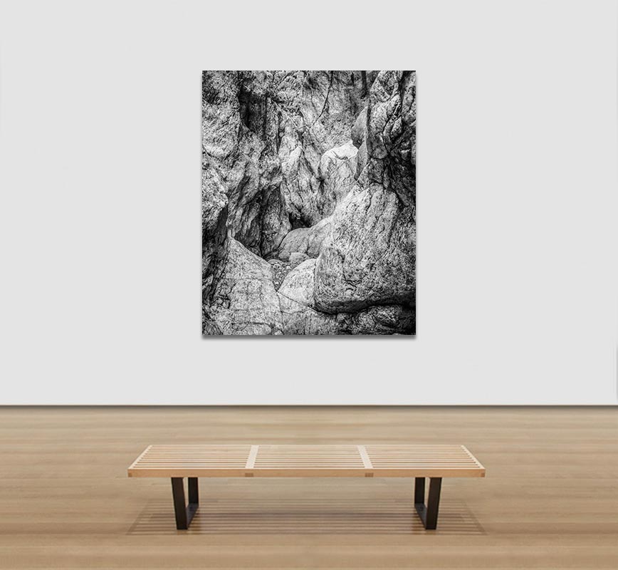 View in a room of Black and white photograph of caves in the Greek island of Kithira inspired by the writings of the ancient Greek philosopher Heraclitus. Title: Homage to Heraclitus: Earth IV