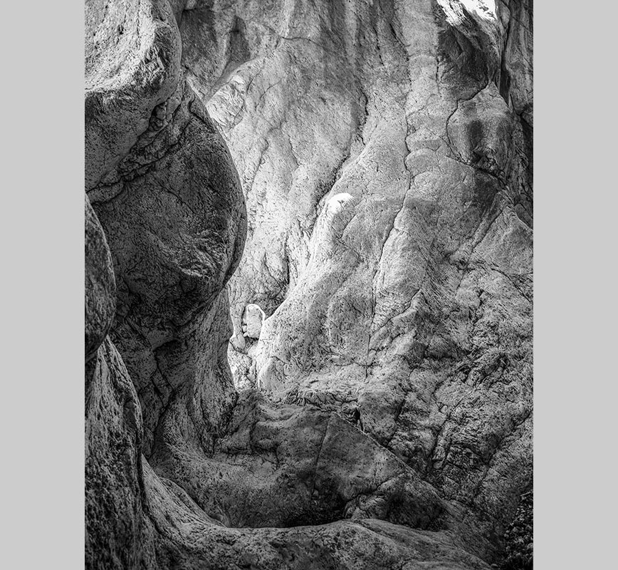 Black and white photograph of caves in the Greek island of Kithira inspired by the writings of the ancient Greek philosopher Heraclitus. Title: Homage to Heraclitus: Earth V