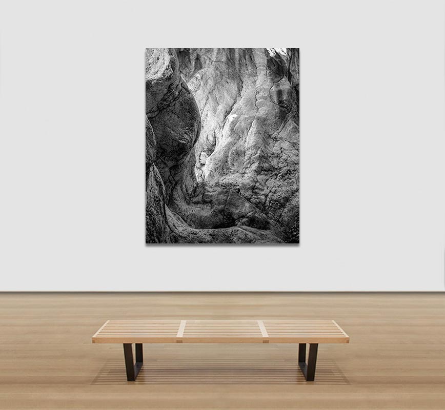 View in a Room of Black and white photograph of caves in the Greek island of Kithira inspired by the writings of the ancient Greek philosopher Heraclitus. Title: Homage to Heraclitus: Earth V