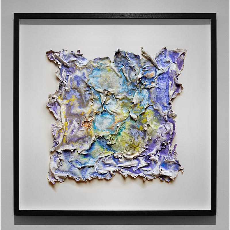 Framed abstract textural work on paper. Mainly yellow and blue colors. Title: Aequinoctium Vernum