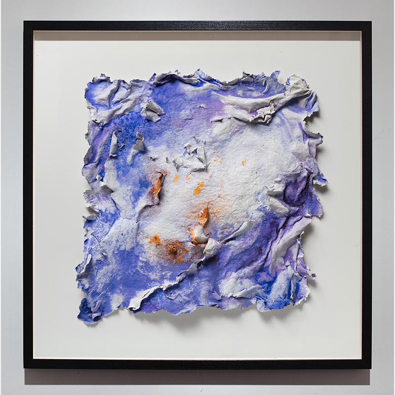 Framed abstract textural work on paper. Mainly blue and orange colors. Title: Lumina Brumalis