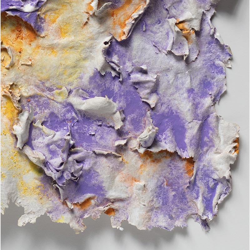 Detail of an abstract textural work on paper. Mainly yellow, orange, and purple colors. Title: Solstitium