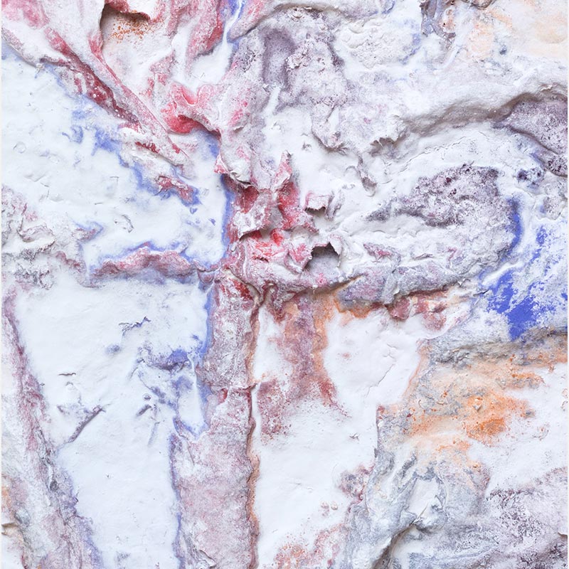 Detail of an abstract textural work on paper. Mainly blue, rose, and white colors. Title: Cineres Pompei