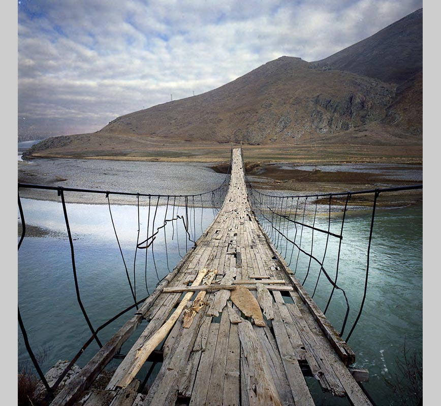 Color Photograph of a wooden bridge in Peru. Limited edition print. Title: Tropics Before the Engine: Wooden Bridge, Peru