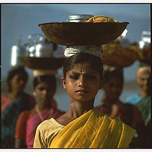 Color Photograph of women in Madurai, India. Limited edition print. Title: Tropics Before the Engine: Young Women Carring a Vessel on their Head, Madurai, India