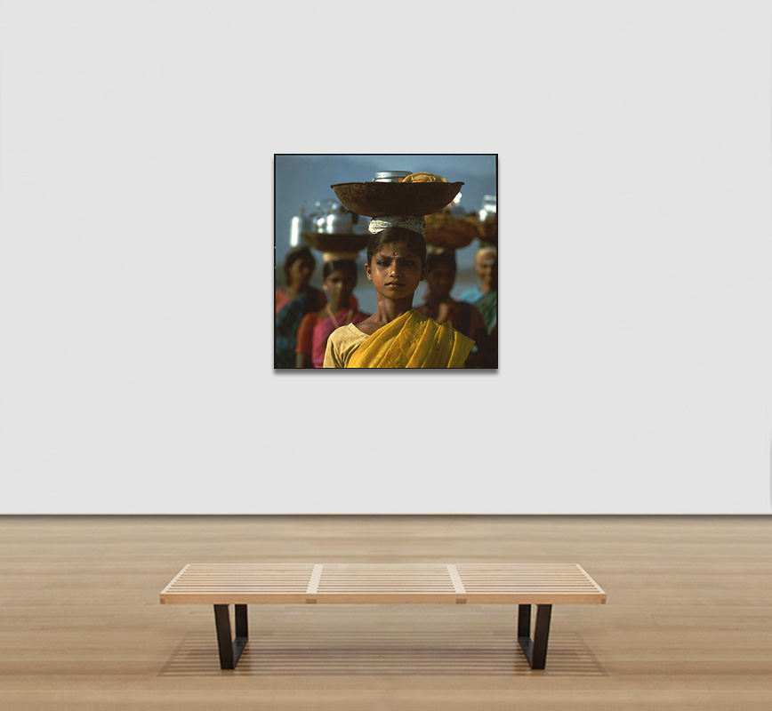 View in a room of a Color Photograph of a Young Lady carrying a vessel over her head, limited edition print. Title: Tropics Before the Engine: Young Women Carring a Vessel on their Head, Madurai, India