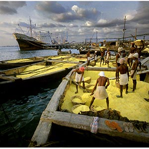 Color Photograph of workers loading sulphur in Cochin, India. Limited edition print. Title: Tropics Before the Engine: Workers Shoveling Sulfur, Cochin, India