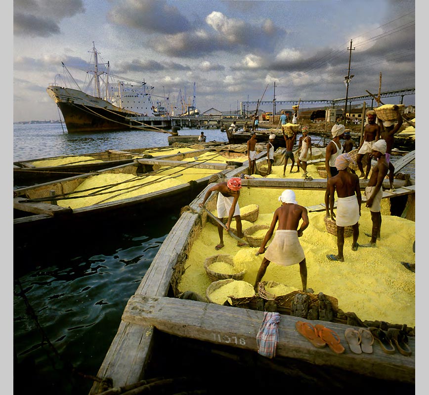 Color Photograph of workers loading sulphur in Cochin, India. Limited edition print. Title: Tropics Before the Engine: Workers shoveling Sulfur, Cochin, India