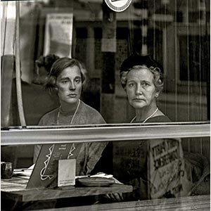 Black and white photograph of two British ladies seen through a window in London. Limited edition print. Title: London during the 1950s, 1950s