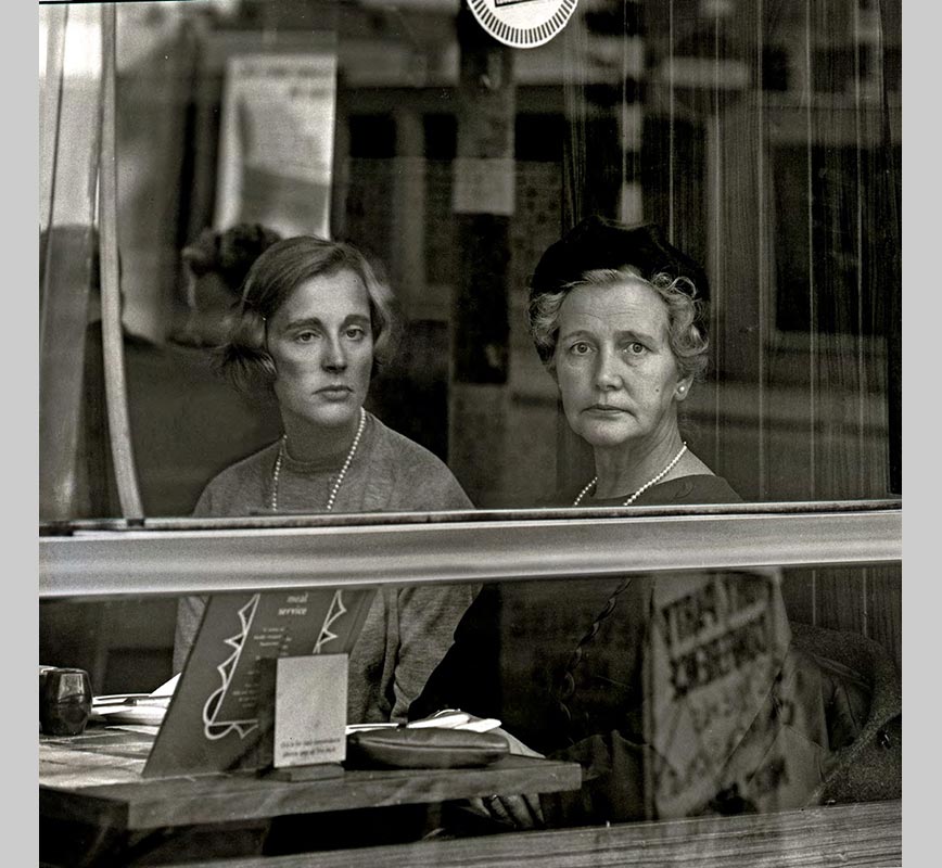 Black and white photograph of two British ladies seen through a window in London. Limited edition print. Title: Untitled