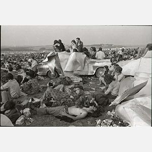 Black and white photograph of hippies camping out at the during the pop festival a the Isle of Wight 1970 Festival. Limited edition print. Title: Hippies at the Isle of Wight 1970 Festival