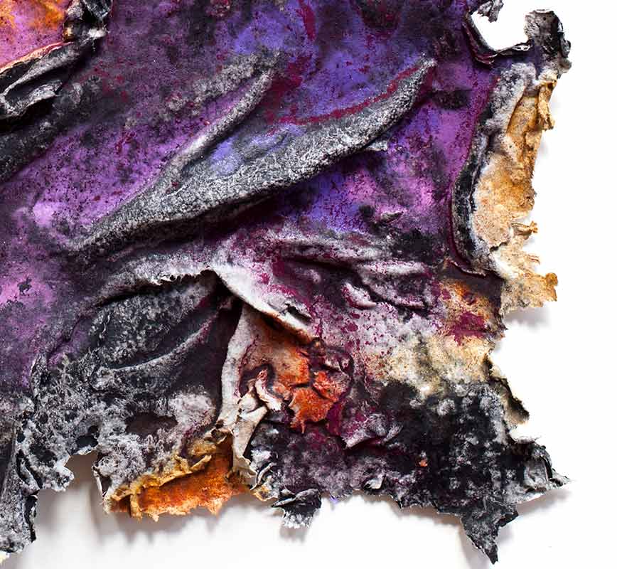 Detail of an abstract textural work on paper. Mainly purple colors. Title: Charta: Ater et Indicus