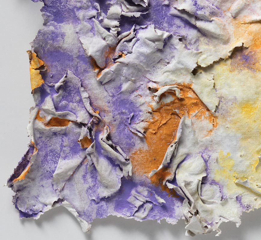Detail of an abstract textural work on paper. Mainly yellow, orange, and purple colors. Title: Solstitium (Summer Solstice)