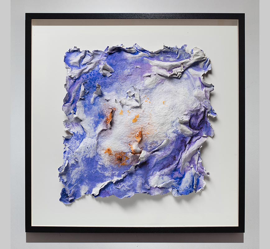 Framed abstract textural work on paper. Mainly blue and orange colors. Title: Lumina Brumalis (Winter Lights)