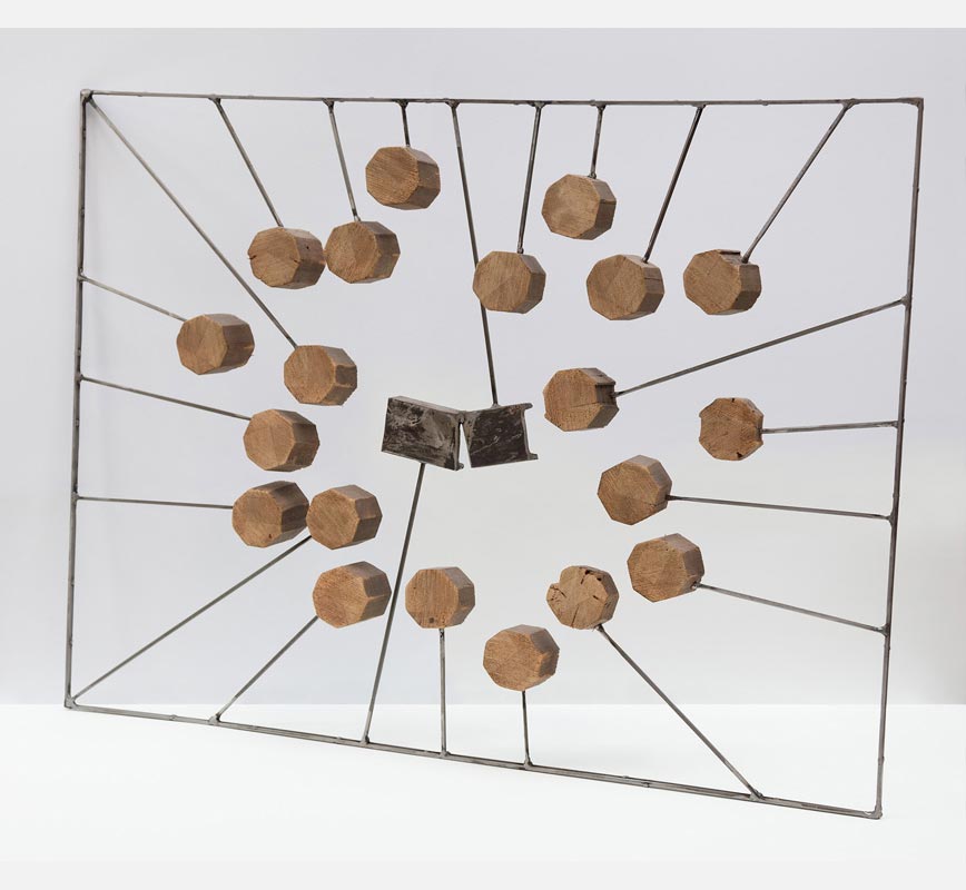 Abstract metal and wood sculpture. Title: Inclusion I